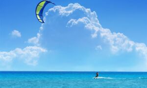 60869 kitesurfing surfing sky clouds sea