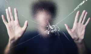 Anonymous man with cracked glass effect