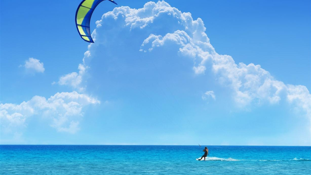 60869 kitesurfing surfing sky clouds sea