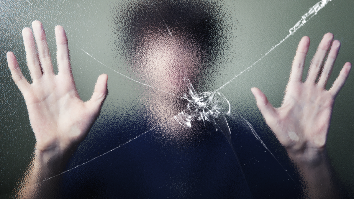 Anonymous man with cracked glass effect